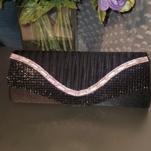 Black pleated satin clutch with pink jewl embellishments